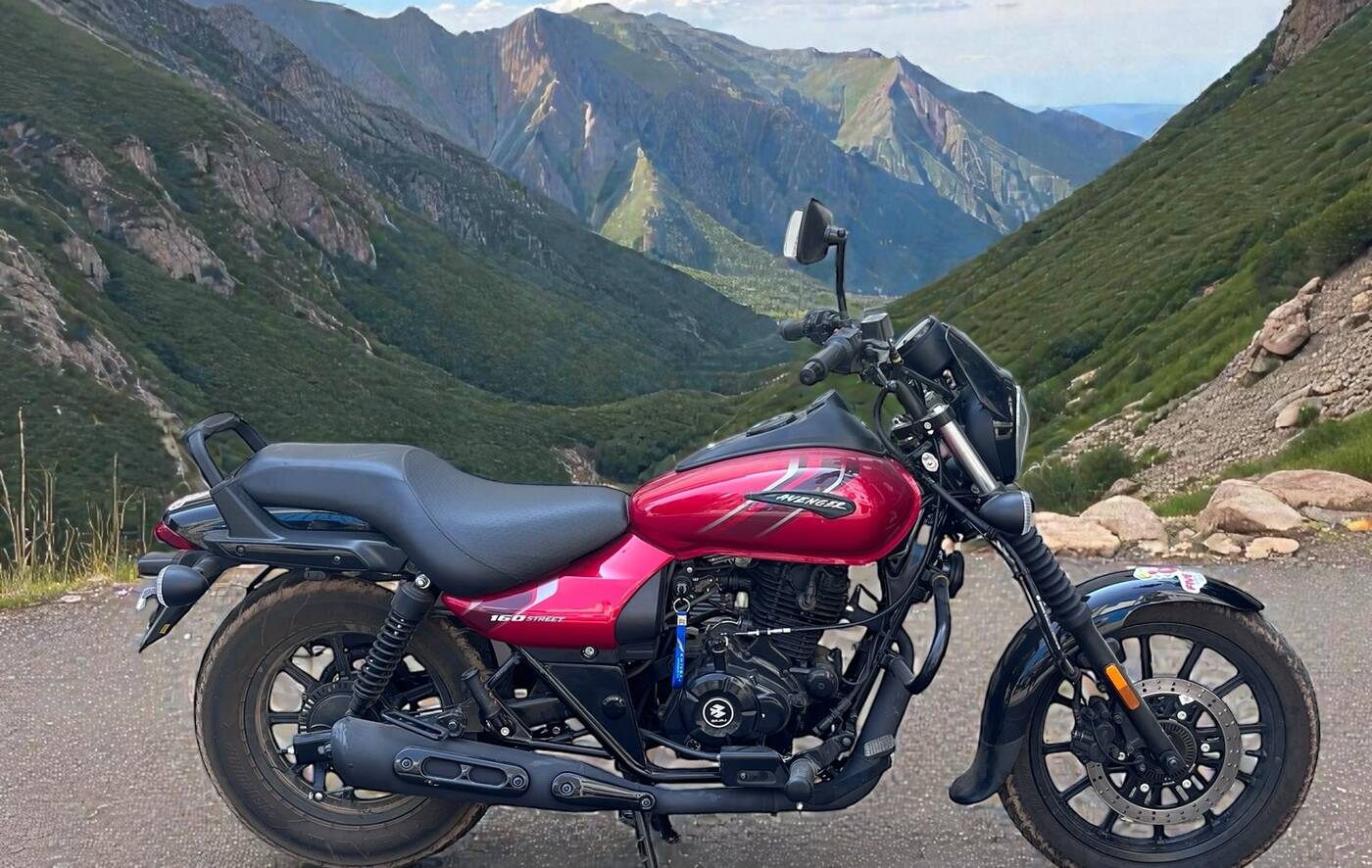 A Bajaj Avenger cruiser on an open mountain road near Bengaluru